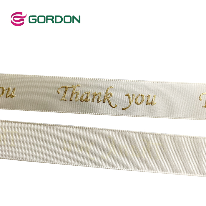 satin ribbon with puff foil printed gold logo
